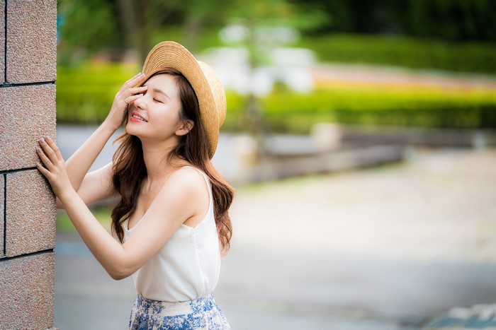 4K Asian Woman Wearing Hat Smiling