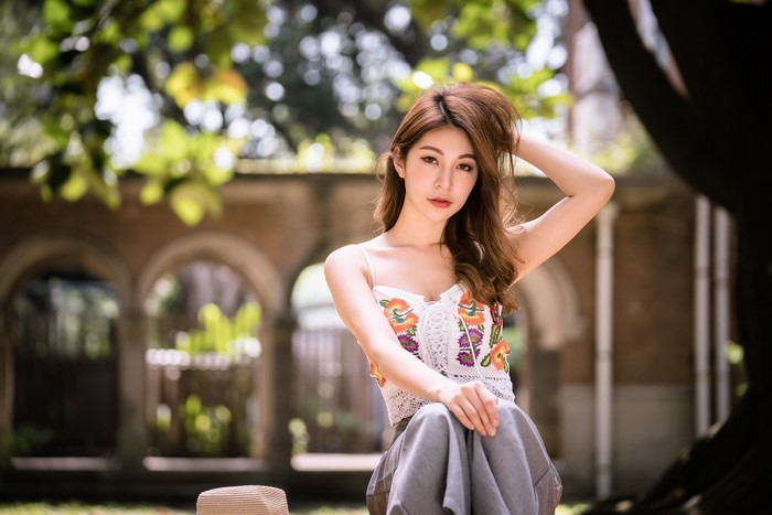 4K Asian Woman Sitting with Bokeh Effect