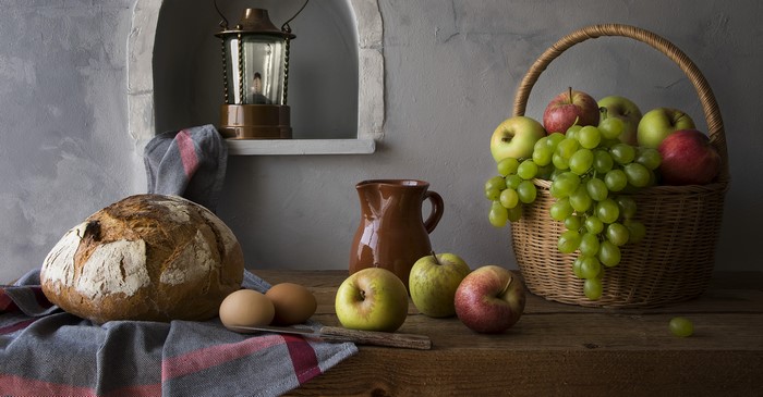 Still-life with bread, fruits, eggs, and jug
