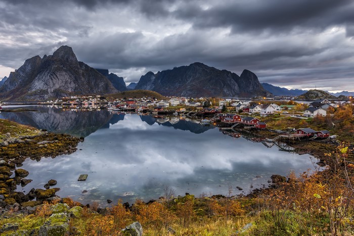 Village of red houses on a bay in Lofoten, Norway