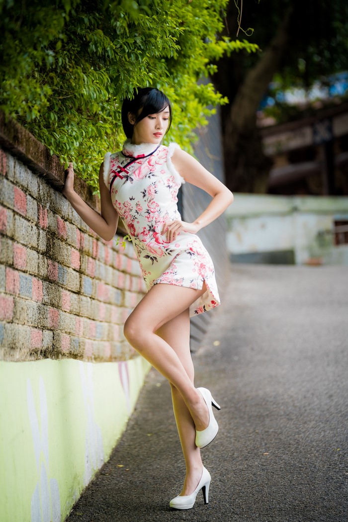 Elegant Asian Woman in Floral Dress and Stilettos