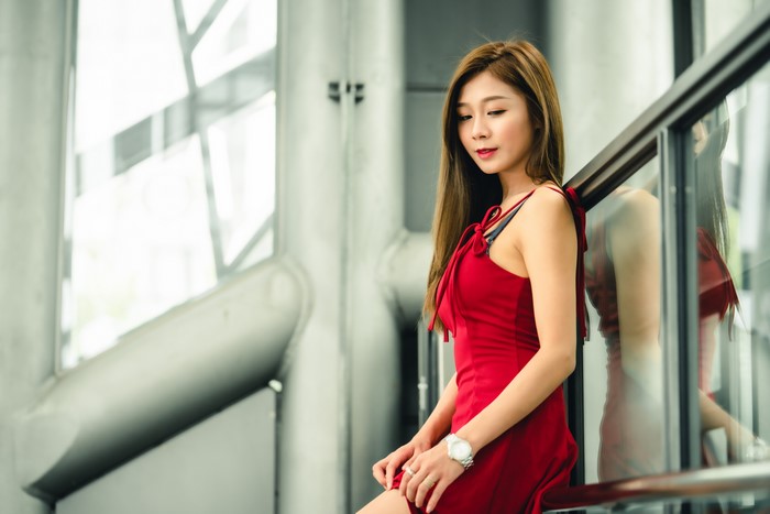 Asian woman in red dress