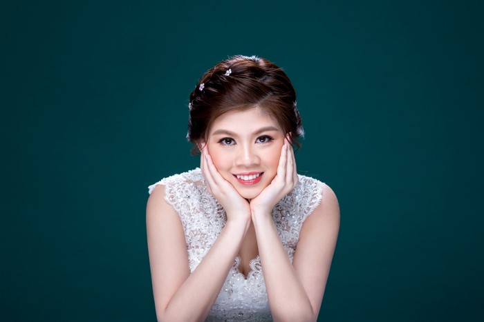 Asian bride with brown hair smiling