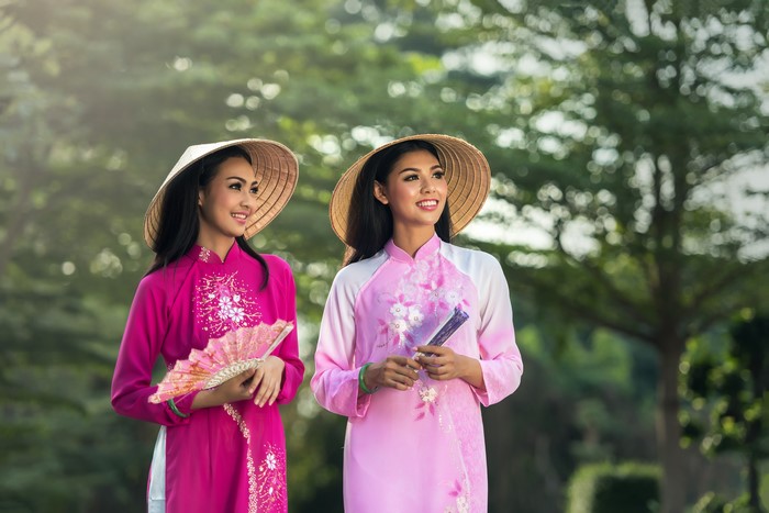 Two Asian Women Wearing Traditional Hats in 4K