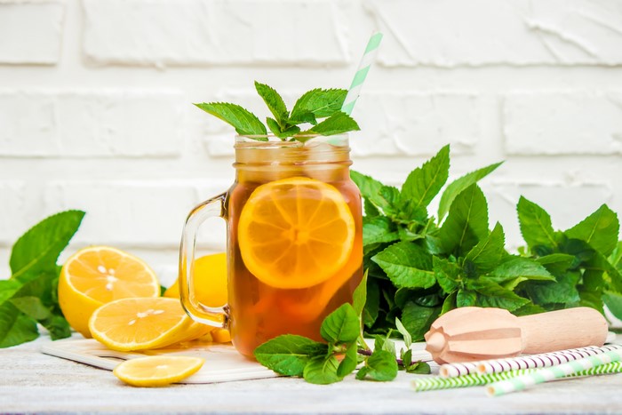 Iced tea with lemon and mint in a jar