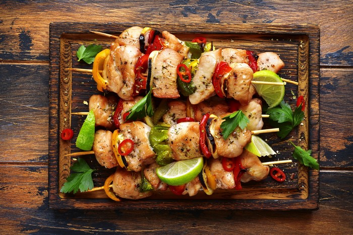 Chicken Shashlik with Vegetables and Lime on a Cutting Board