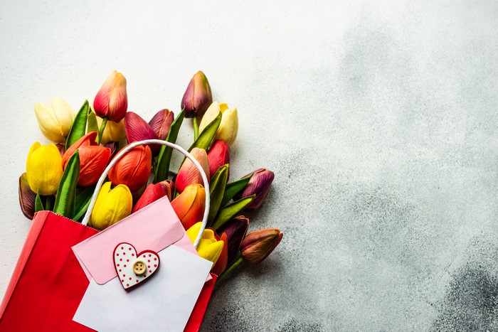 Bouquet of Tulips in a Red Paper Bag with Greeting Card