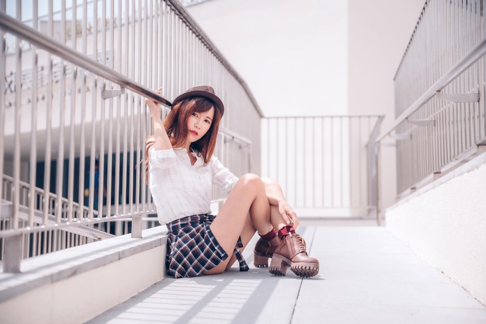4K Asian Woman Sitting in Skirt and Hat