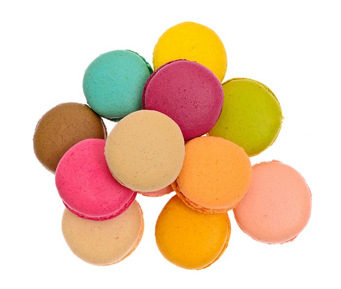 Pile of colorful macarons on a white background