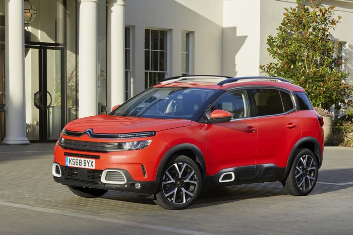 Red Citroen C5 Aircross parked outside building