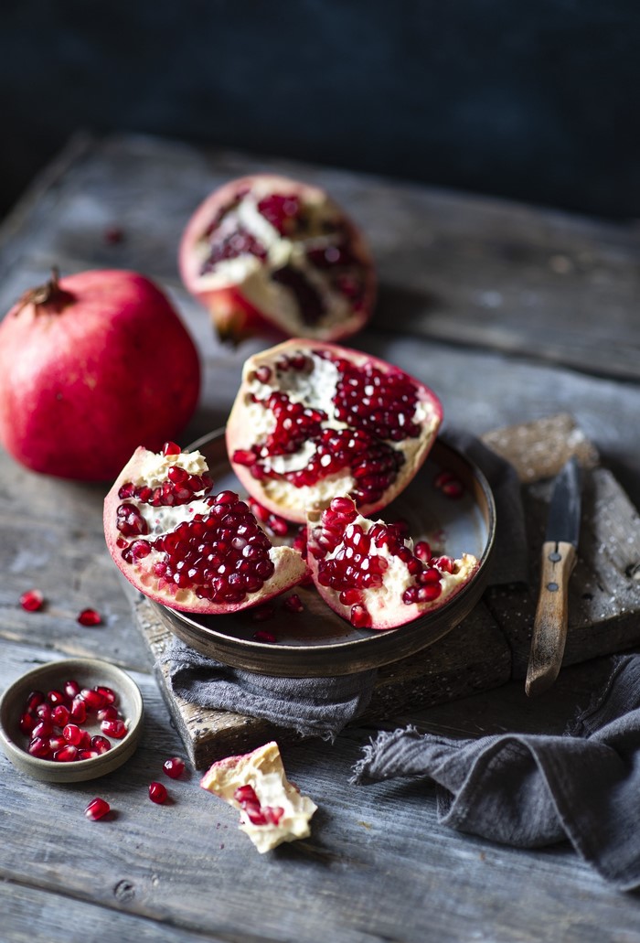 Pomegranates on a wooden table