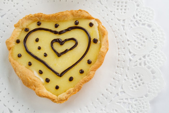 Heart-shaped pastry with chocolate decoration