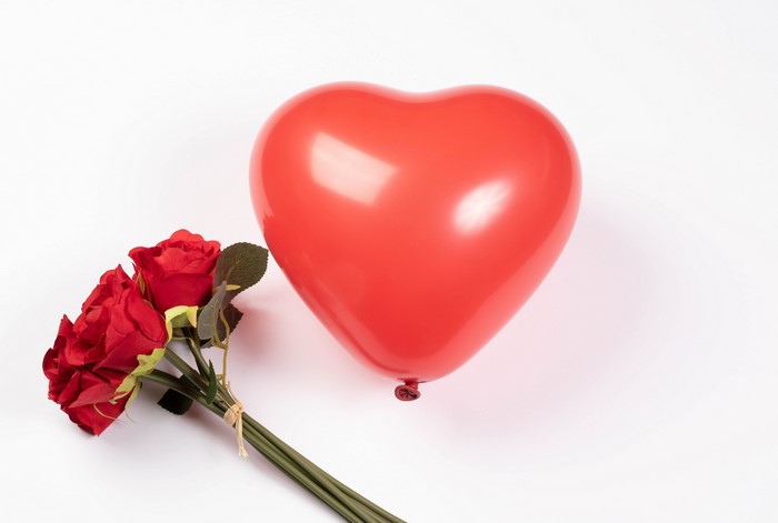 Red heart balloon and red roses bouquet