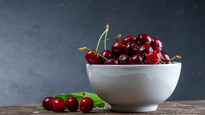 Bowl of Cherries with Leaves