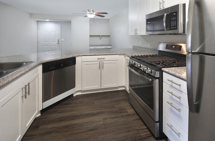 Kitchen with stainless steel appliances and white cabinets