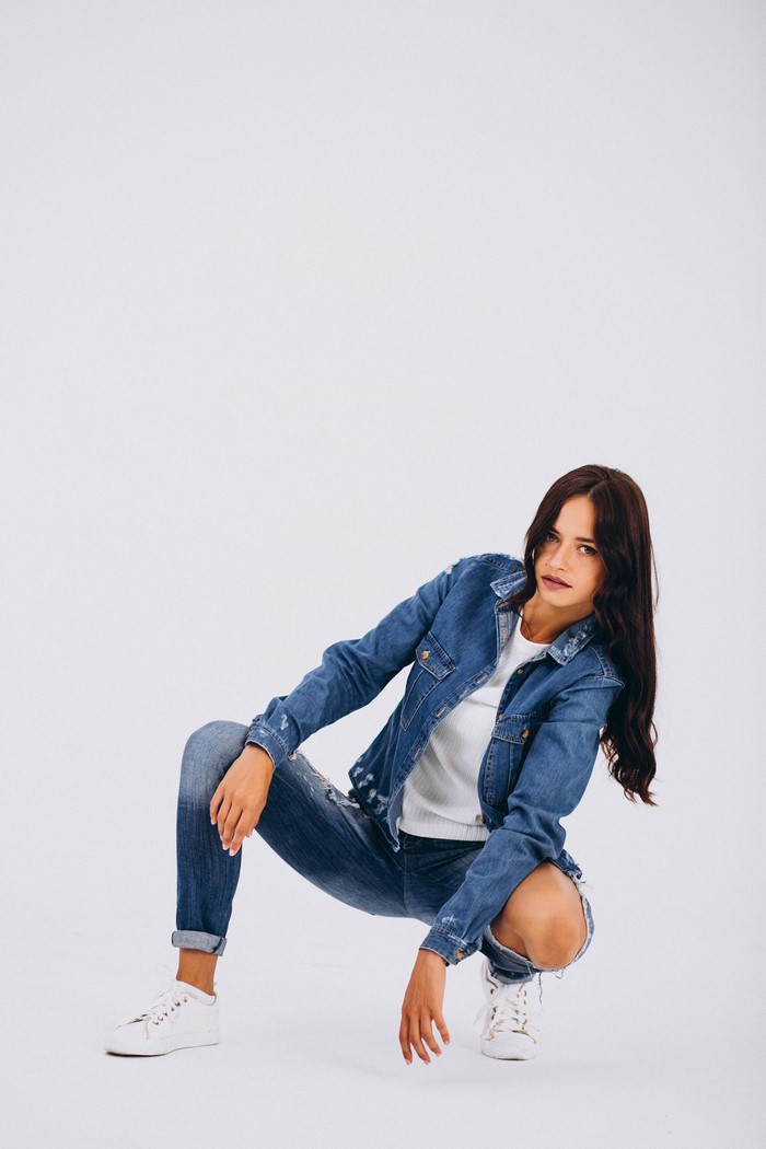 Brunette girl in jeans and denim jacket