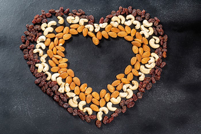 Heart shape made of nuts and raisins