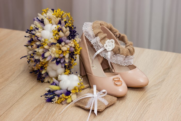 Wedding bouquet, shoes, rings, and ring pillow