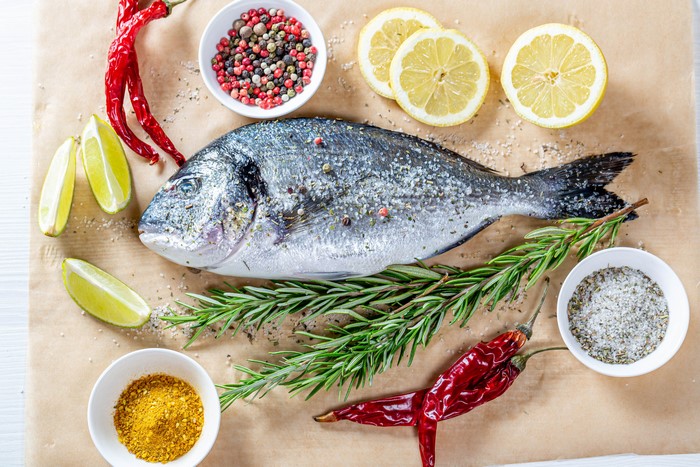 Whole fish with lemon, chili, and spices