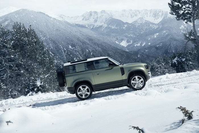 Land Rover Defender 90 in a snowy mountain landscape