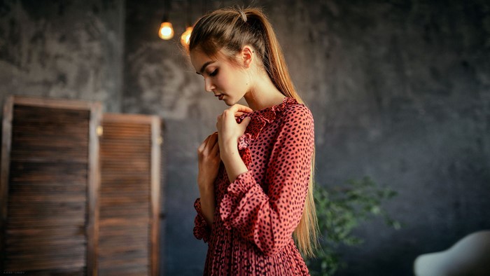 Woman in polka dot dress by Aleksei Iurev