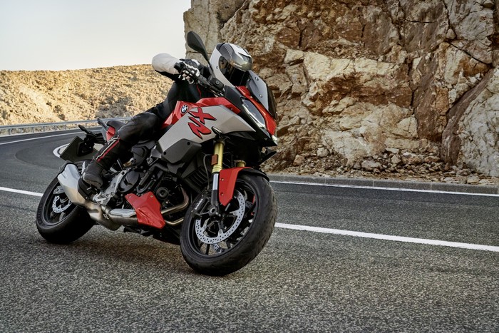 BMW F 900 XR motorcycle with rider on a mountain road