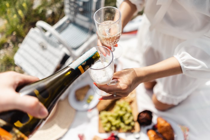 Champagne Pouring at a Picnic
