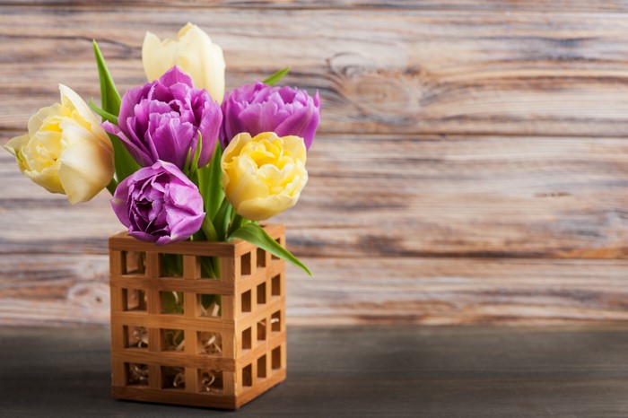 Tulips in a wooden vase