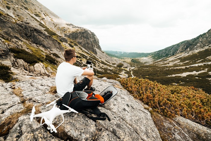 Man with Drone in Mountains