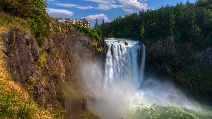 Snoqualmie Falls with historic lodge and forest