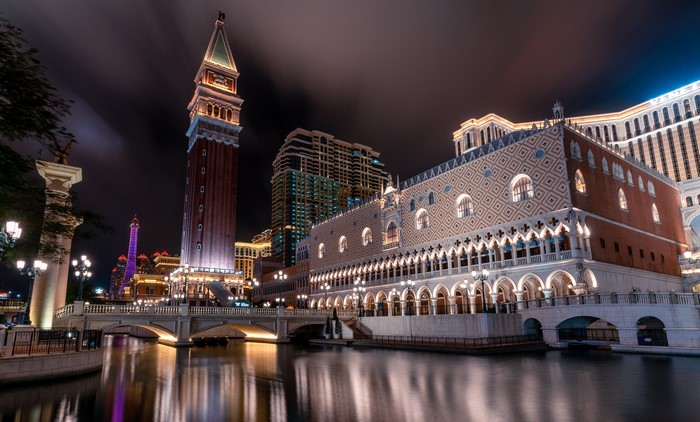The Venetian Macao at night with canal and bridge