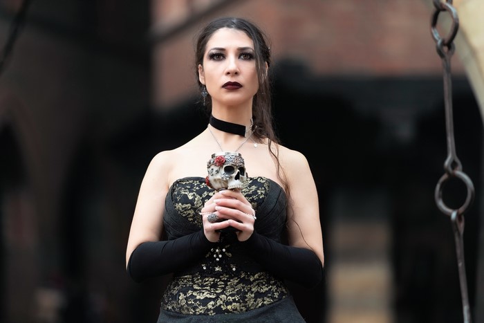 Gothic woman holding a skull