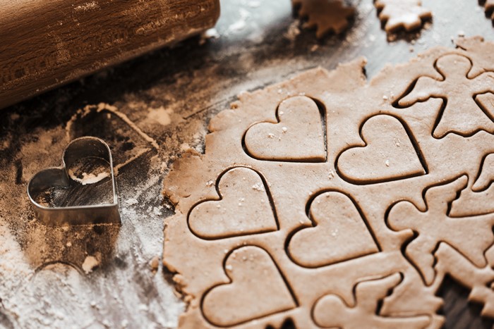 Cookie dough with heart and angel shapes