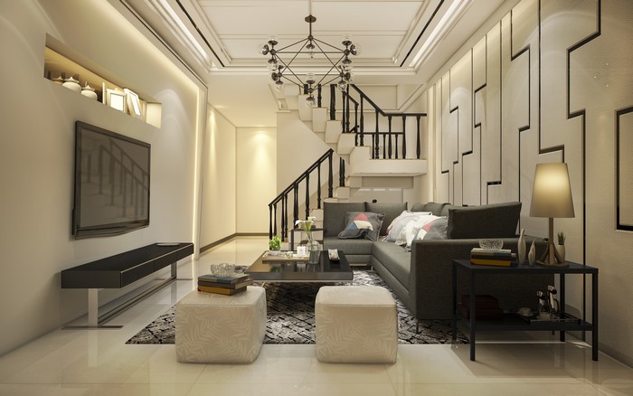 Modern living room with sectional sofa and stairs
