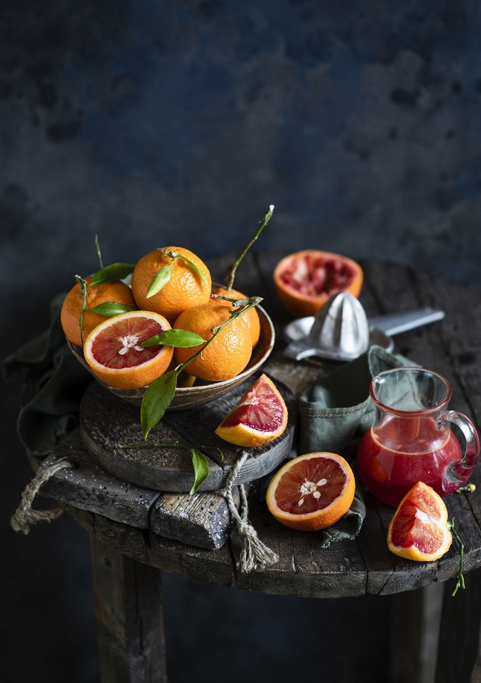Still life of blood oranges and juice