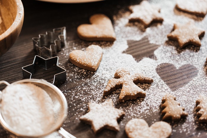 Cookies with powdered sugar and cookie cutters