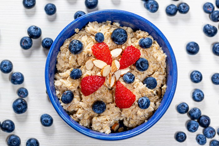 Oatmeal with Blueberries, Strawberries, and Nuts in a Bowl