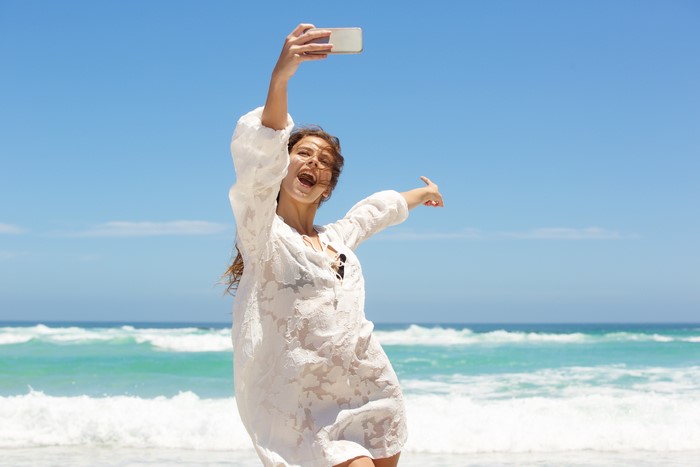 Woman taking a selfie on the beach
