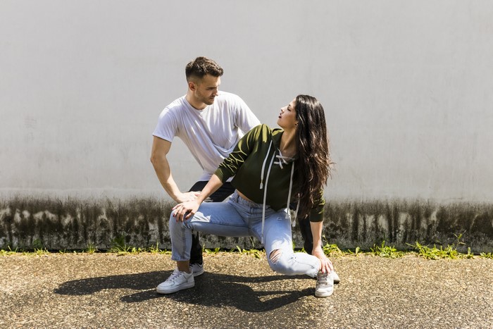 Man and woman dancing outdoors