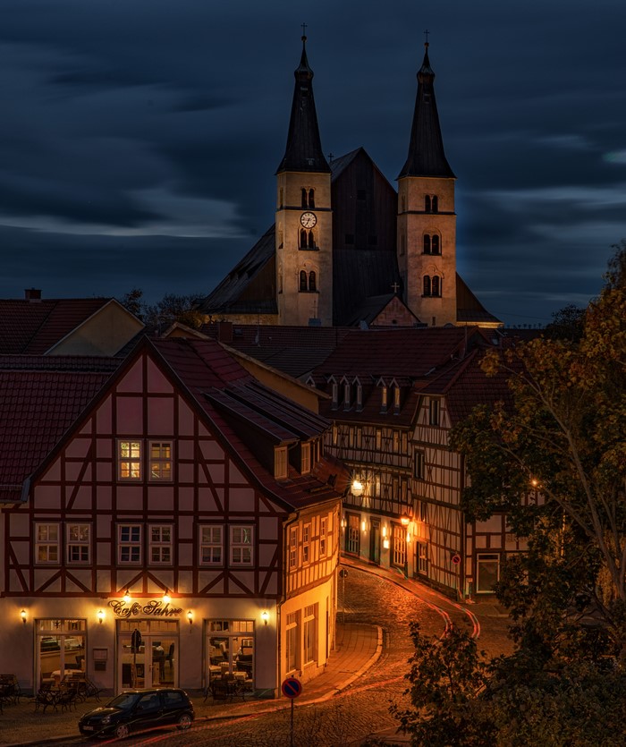 Half-timbered houses and church towers at night in Nordhausen, Germany