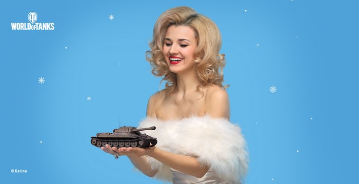 Karina from World of Tanks holding a toy tank