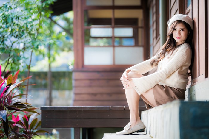 4K Asian Woman Sitting in Sweater and Beret