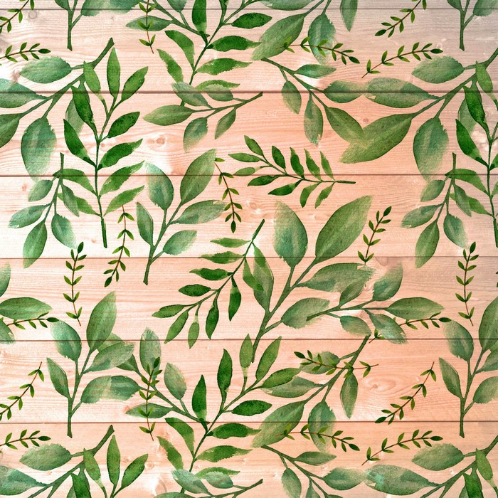 Green leaves on wood plank texture