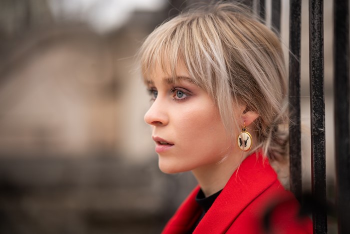 Blonde girl with bangs and earring