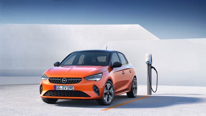 Orange Opel Corsa E electric car at charging station