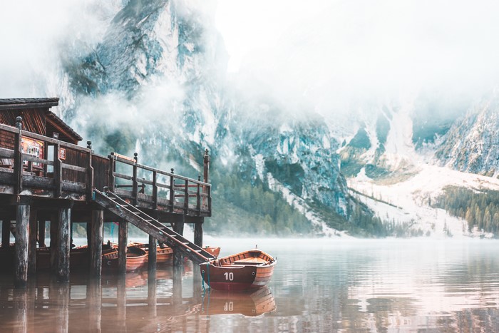 Boats at Lake Braies with Mountains and Fog