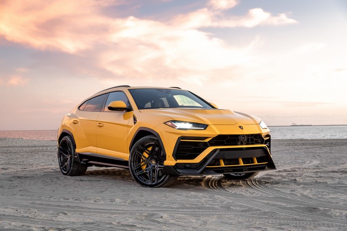 Yellow Lamborghini Urus by Vorsteiner on Sand
