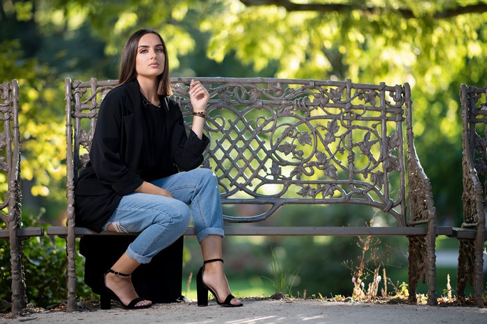 Woman sitting on a bench in a park