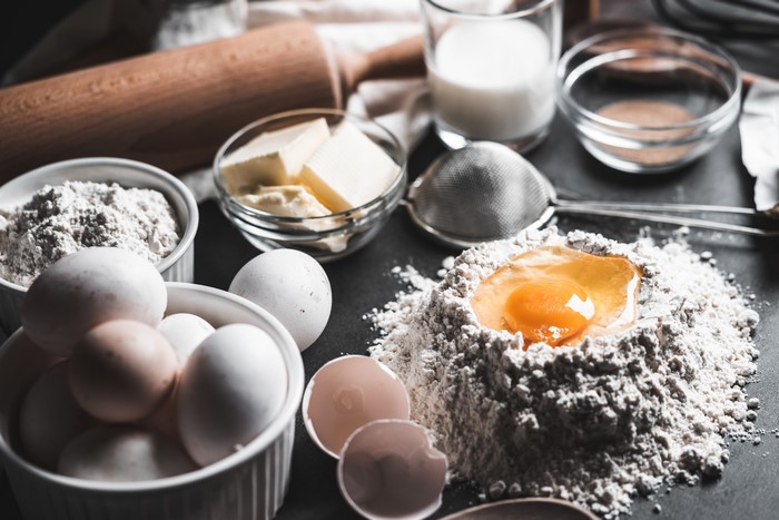 Baking Ingredients: Flour, Eggs, Butter, Milk, and Rolling Pin