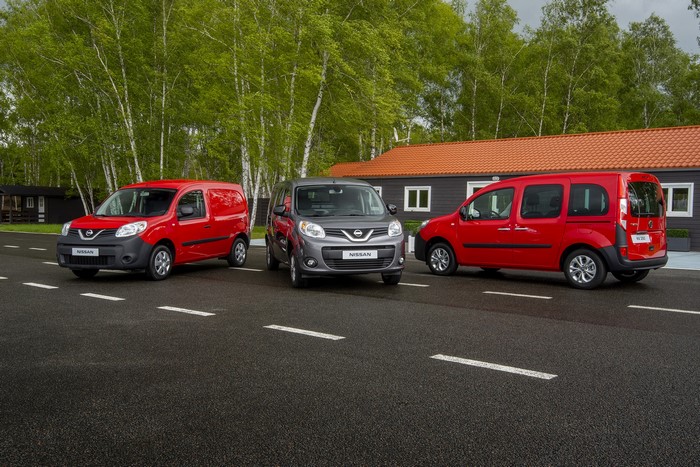 Three Nissan NV250 vans in metallic colors